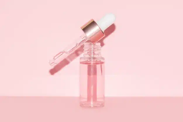 pink-serum-bottle-with-pipette-pink-background_164859-237