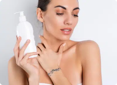 image of a woman holding a plastic cosmetic container