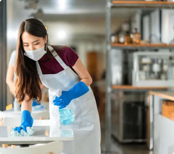asian-staff-waitress-wearing-protection-face-mask-apron-rubber-glove-cleaning-table-with-disinfectant-alcohol-spray-prevent-infection-coronavirus-cafe-coffee-shop-new-normal-concept