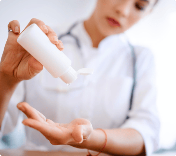 caucasian-nurse-applying-sanitizer-hospital-during-quarantine-doctor-using-antiseptic