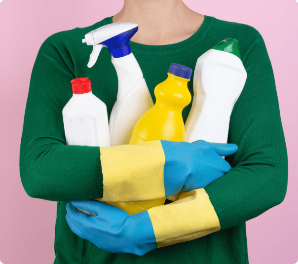 image of a woman holding cleaning products