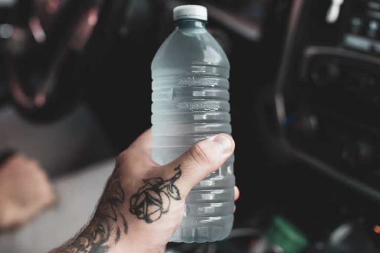 image of a person holding a water bottle