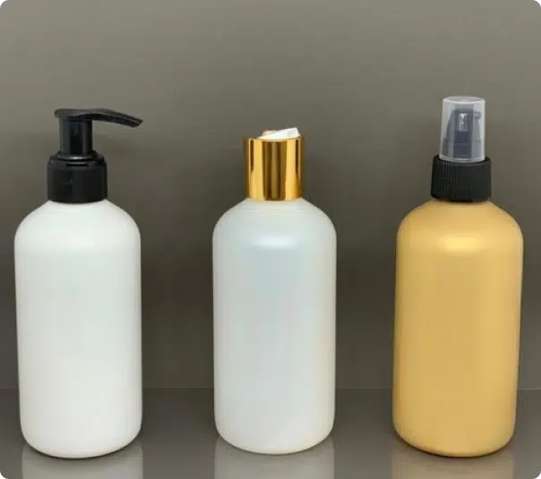 empty plastic lotion bottles in different colors