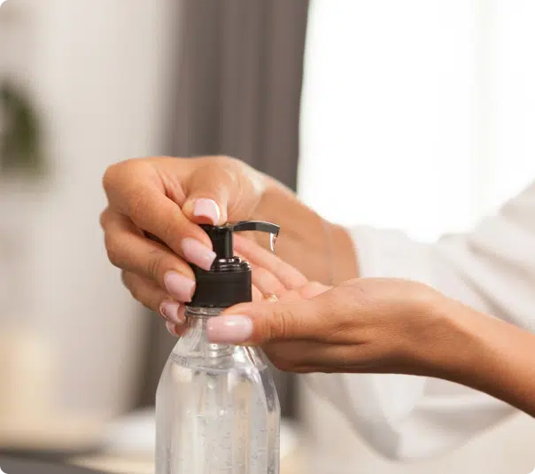 image of a person using a pump bottle