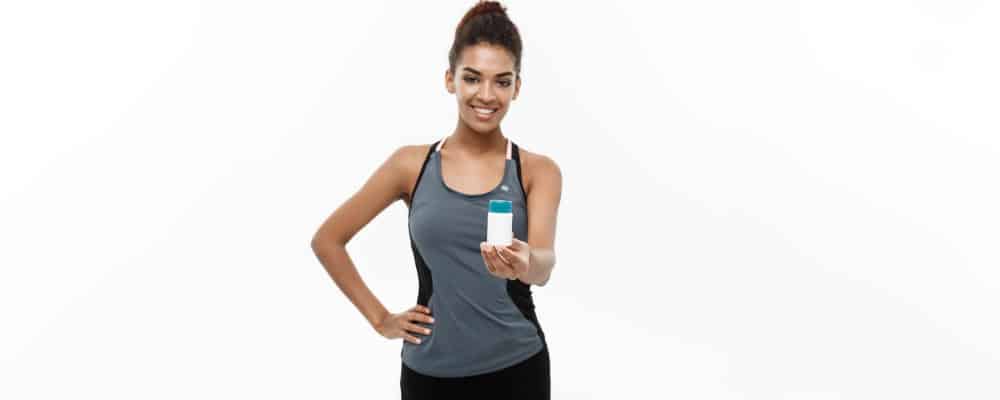 Image of a woman holding an empty pill bottle