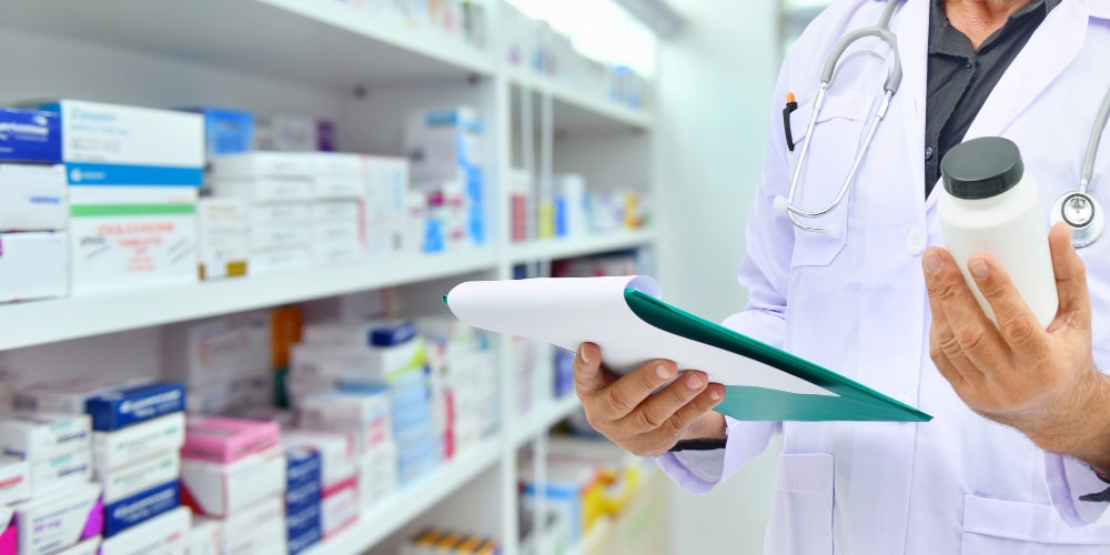 Image of checking a plastic bottle with medicine