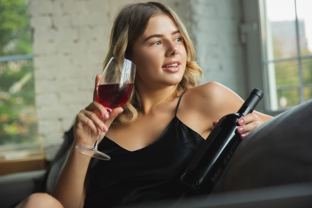 Image of a girl holding a wine glass in her hand