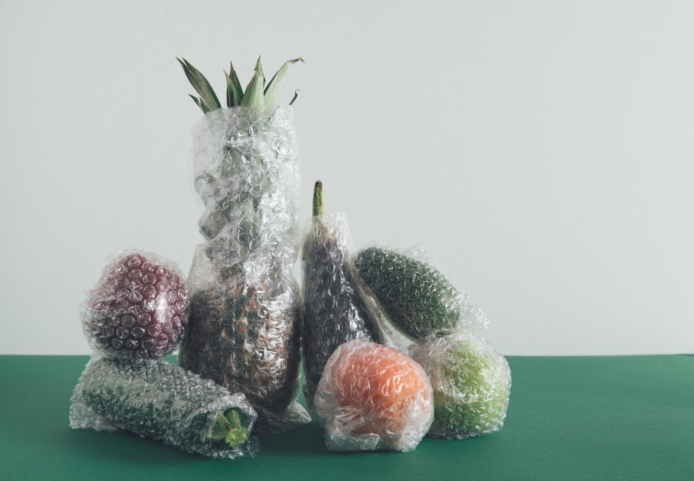 Image of fruits and vegetables wrapped with plastic packaging