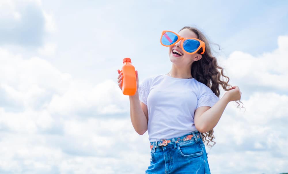 Image of a girl holding HDPE bottle