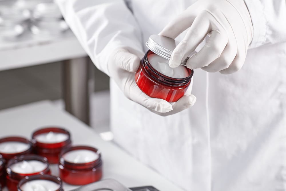 Image of a man checking a cosmetic jar