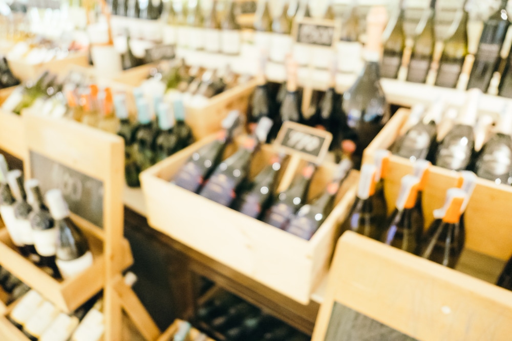 Blurred image of alcohol bottles in shelves