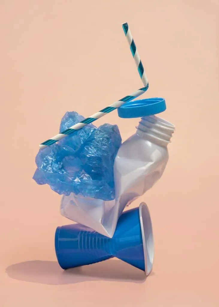 plastics cups bottles shopping bag with drinking straw  