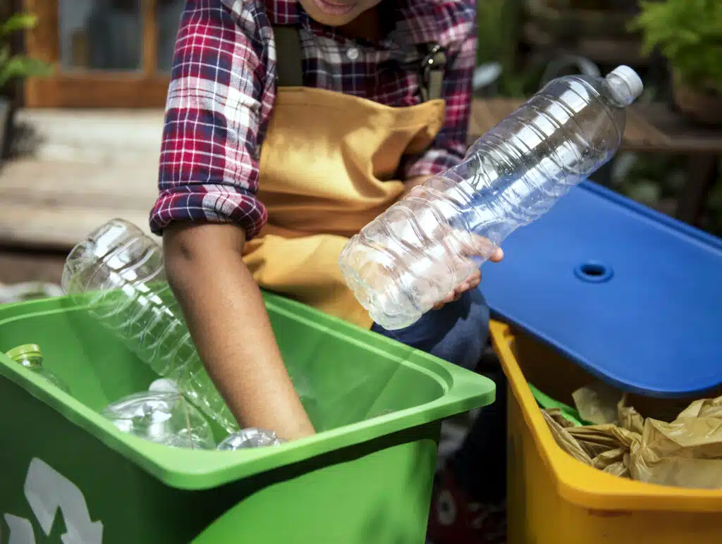 recyclable plastic bottles hand with women