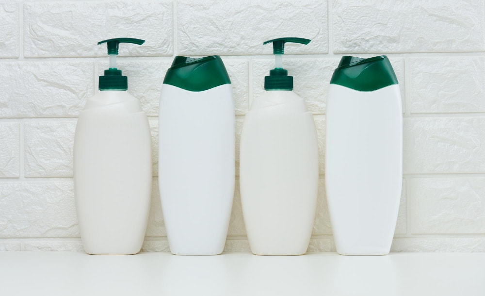 image of white shampoo bottles