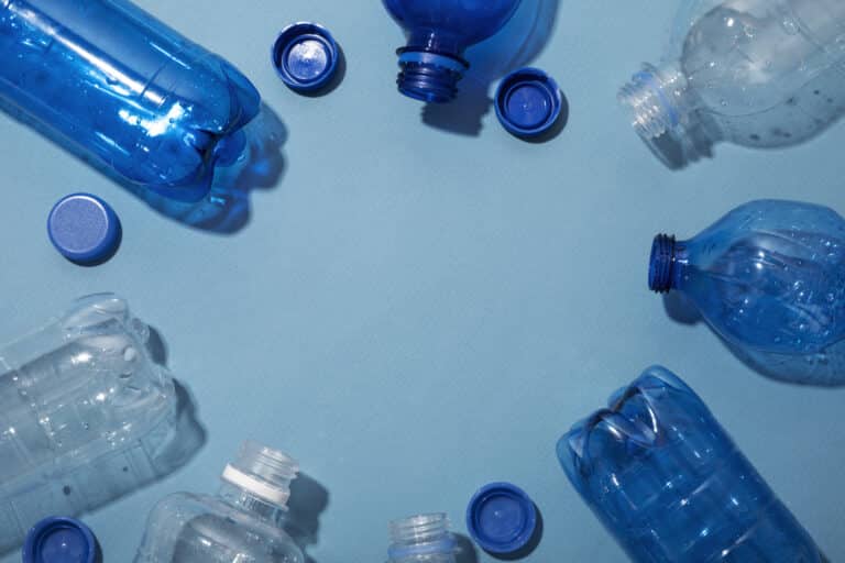 Blue background plastic water bottles