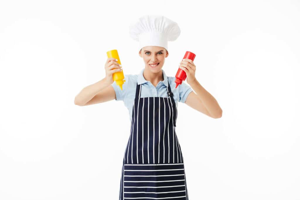 Image of a woman applying sauce from plastic squeeze bottles