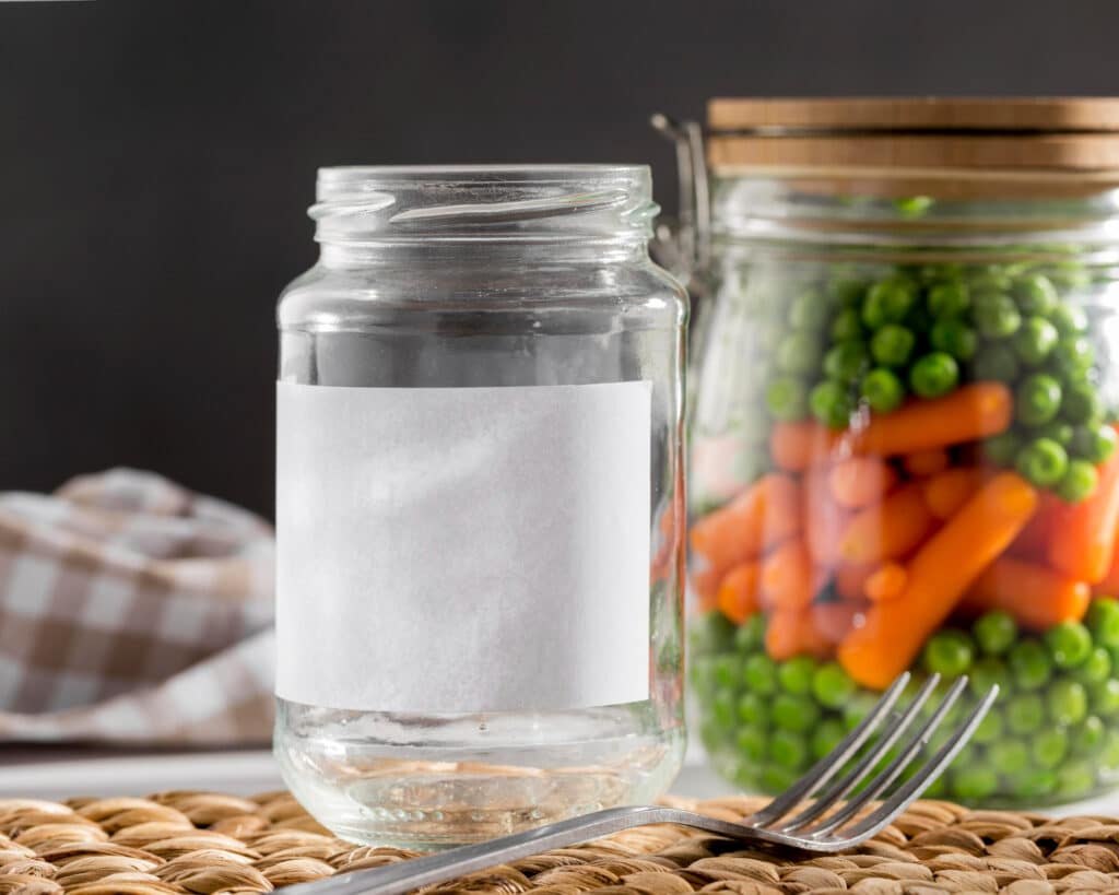 Image of a close-up plastic jar with vegetables