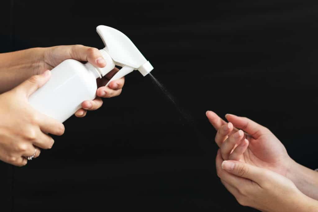 Image of a spray bottle in hand