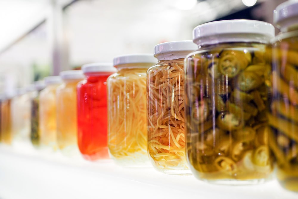image of different foods inside plastic mason jars