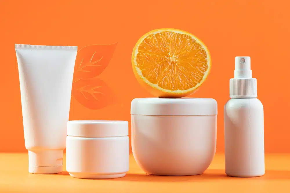 an image of white cosmetic packaging supplies with orange and orange background