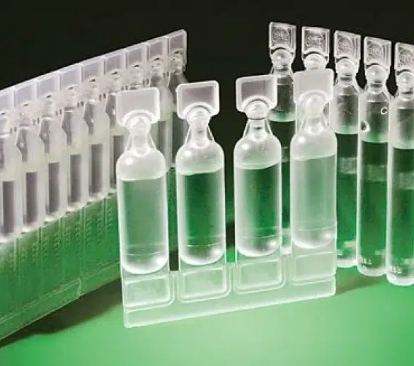 bulk eye dropper bottles in a green background