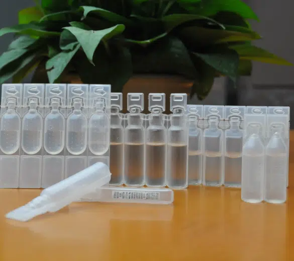 bulk eye dropper bottles on top of a wooden tabe