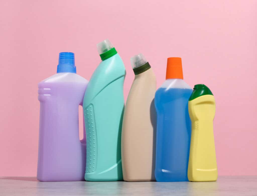 Colorful 32 oz plastic bottle with different detergents and cleaning agents. Idea of cleanliness.