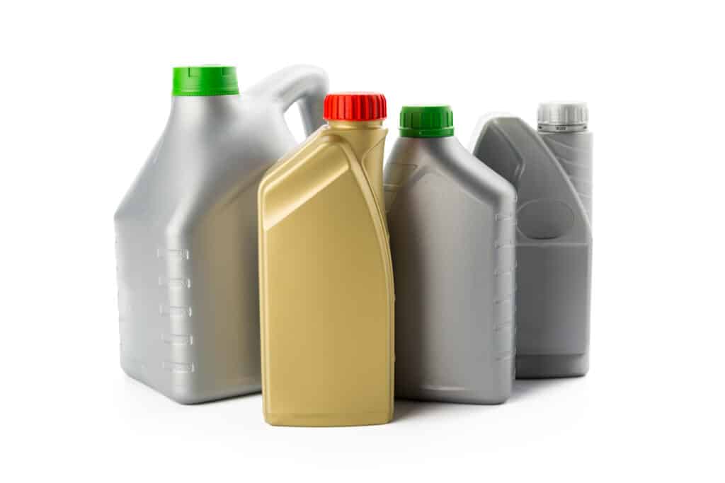 Plastic bottles from automobile oils isolated on white