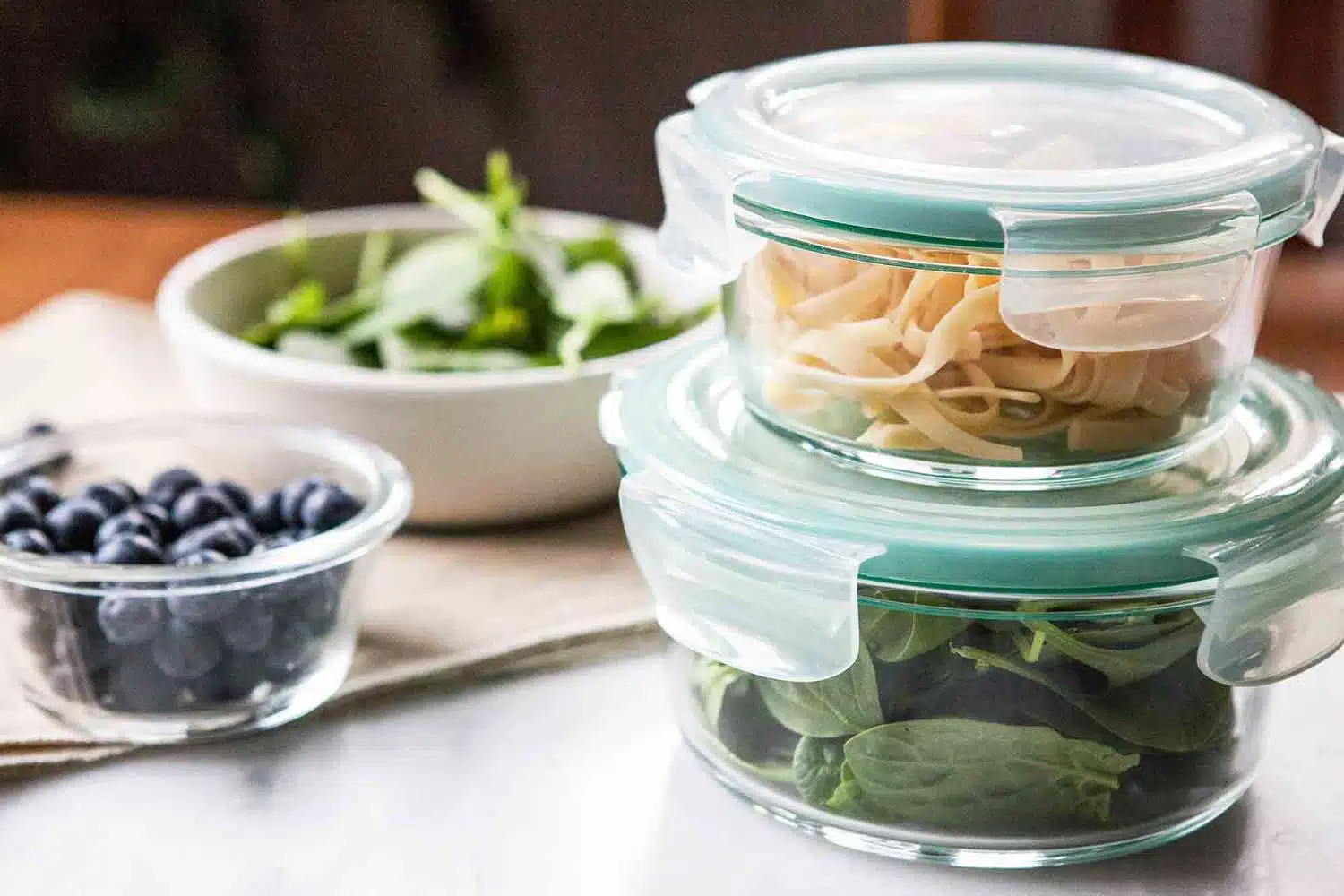 Fresh food packaged in plastic containers with lids.