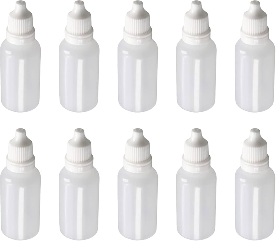 Multiple white plastic eye dropper bottles