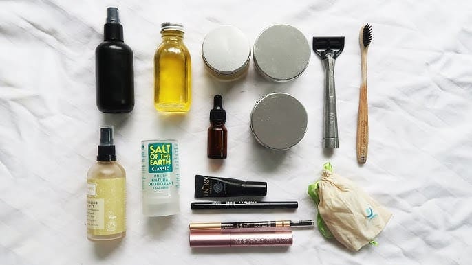 Essential items laid out for a travel size toiletries kit