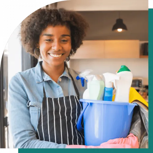 image of a woman holding cleaning products